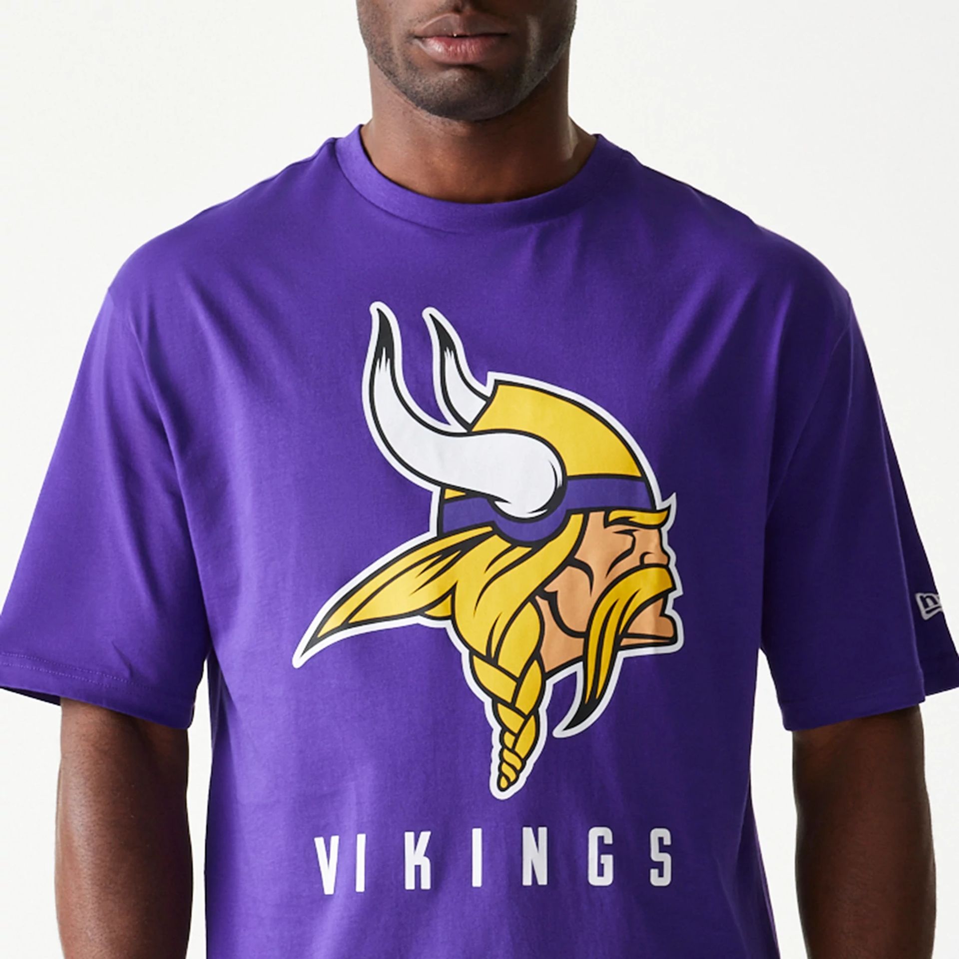 The Male model is wearing Minnesota Vikings NFL Games Slogan Purple Oversized T-Shirt 2