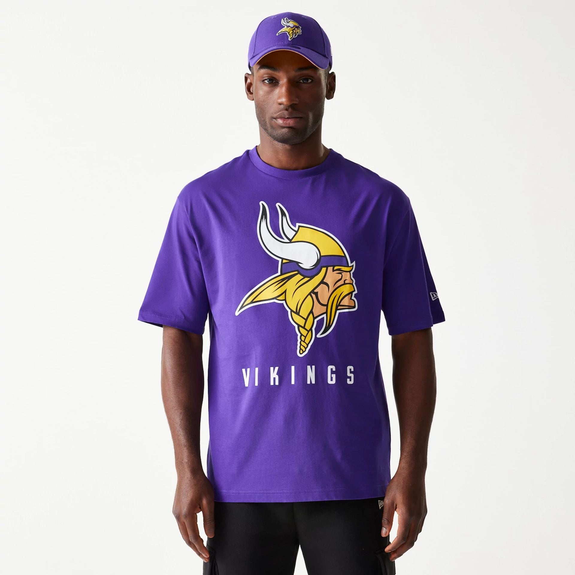 The Male model is wearing Minnesota Vikings NFL Games Slogan Purple Oversized T-Shirt 1