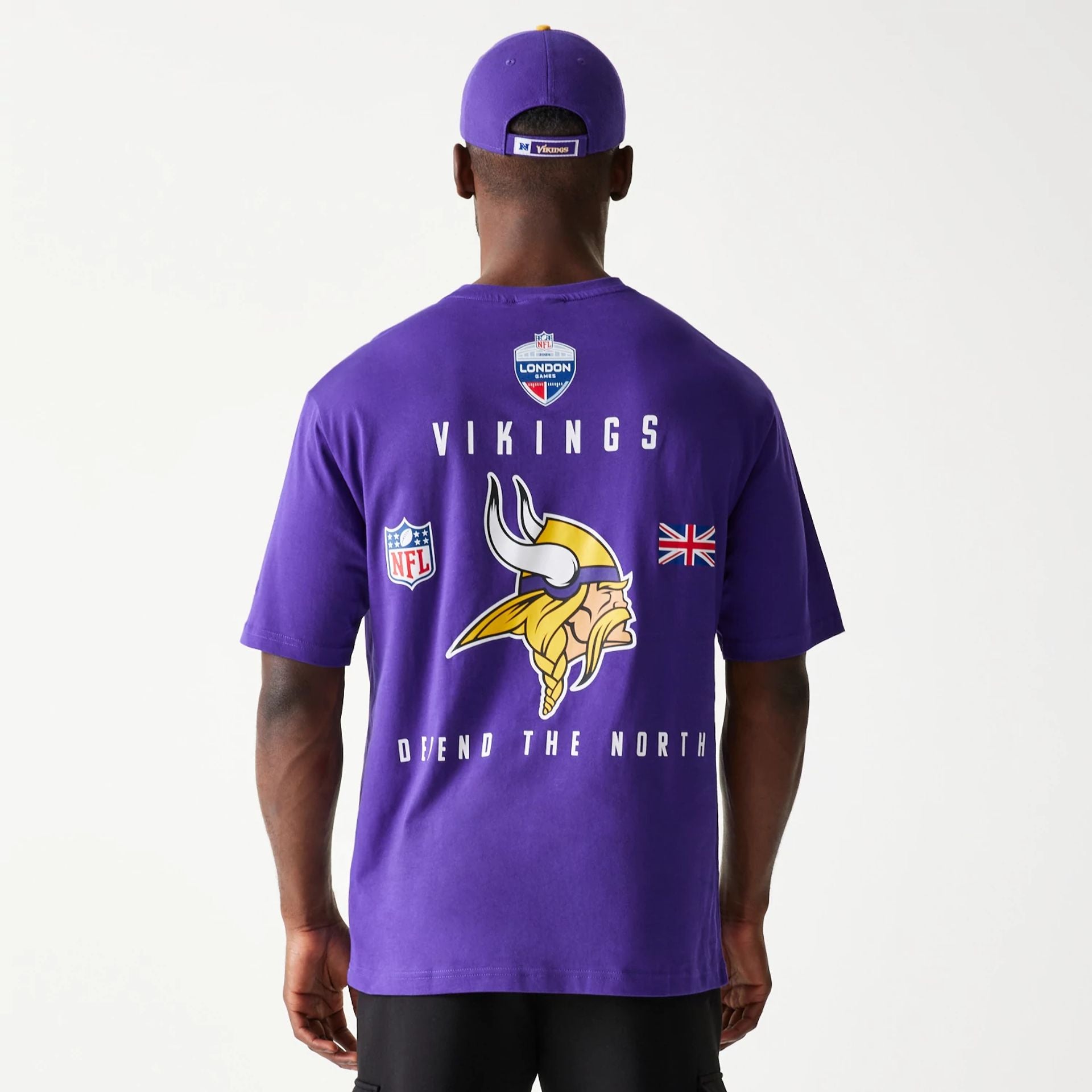 The Male model is wearing Minnesota Vikings NFL Games Slogan Purple Oversized T-Shirt 7