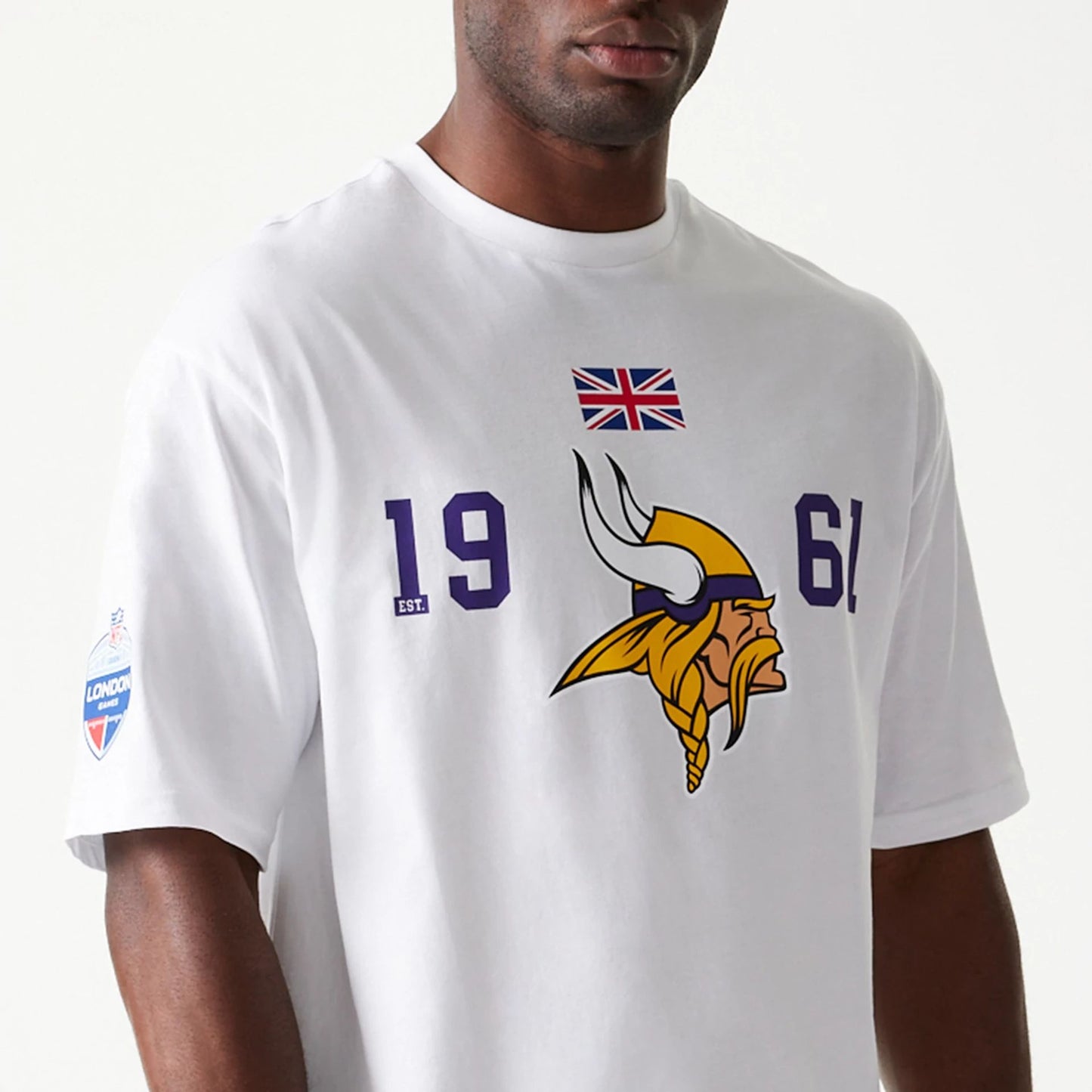 The Male model is wearing Minnesota Vikings NFL Games Square Arch White Oversized T-Shirt 2