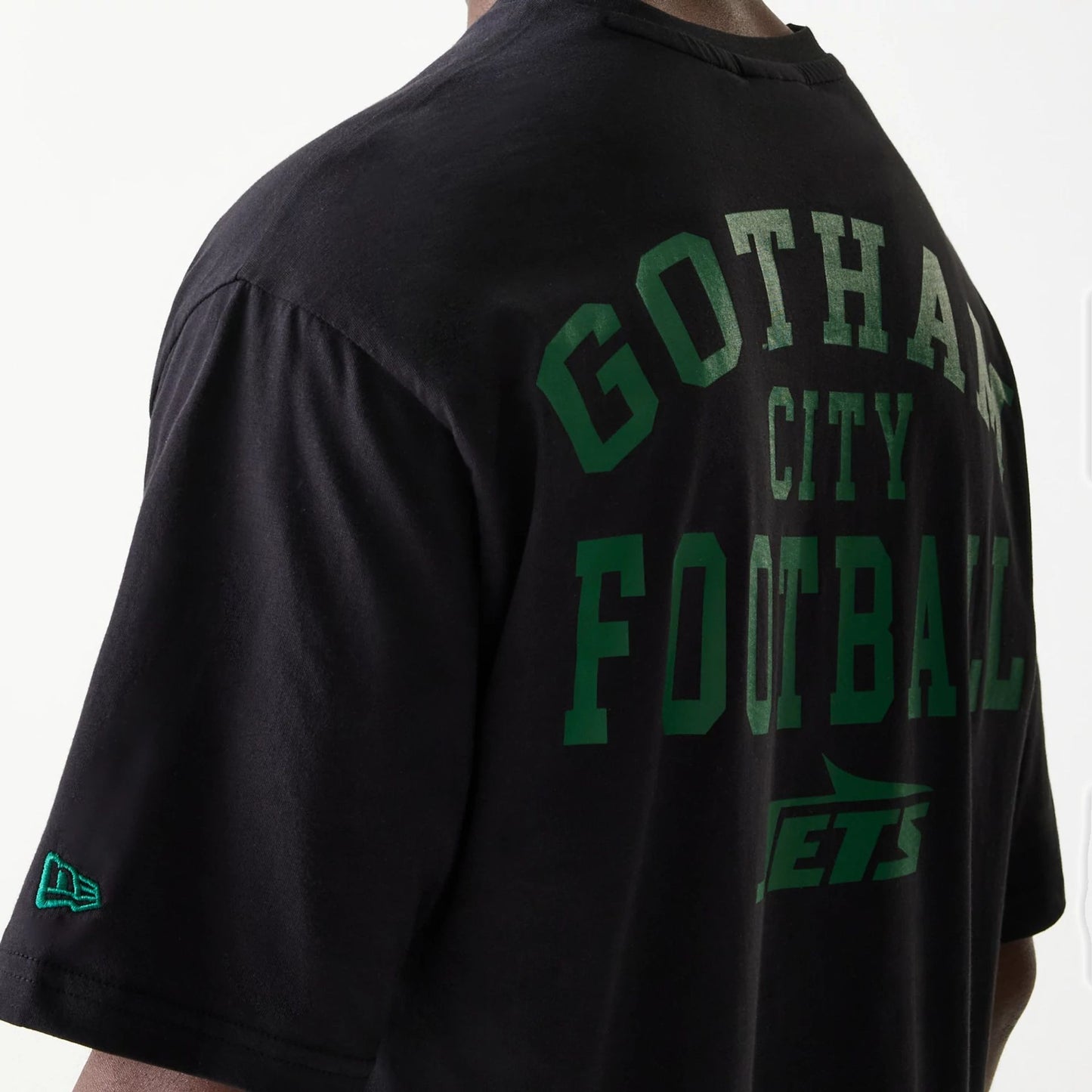 The Male model is wearing New York Jets NFL Games Square Arch Black Oversized T-Shirt 4