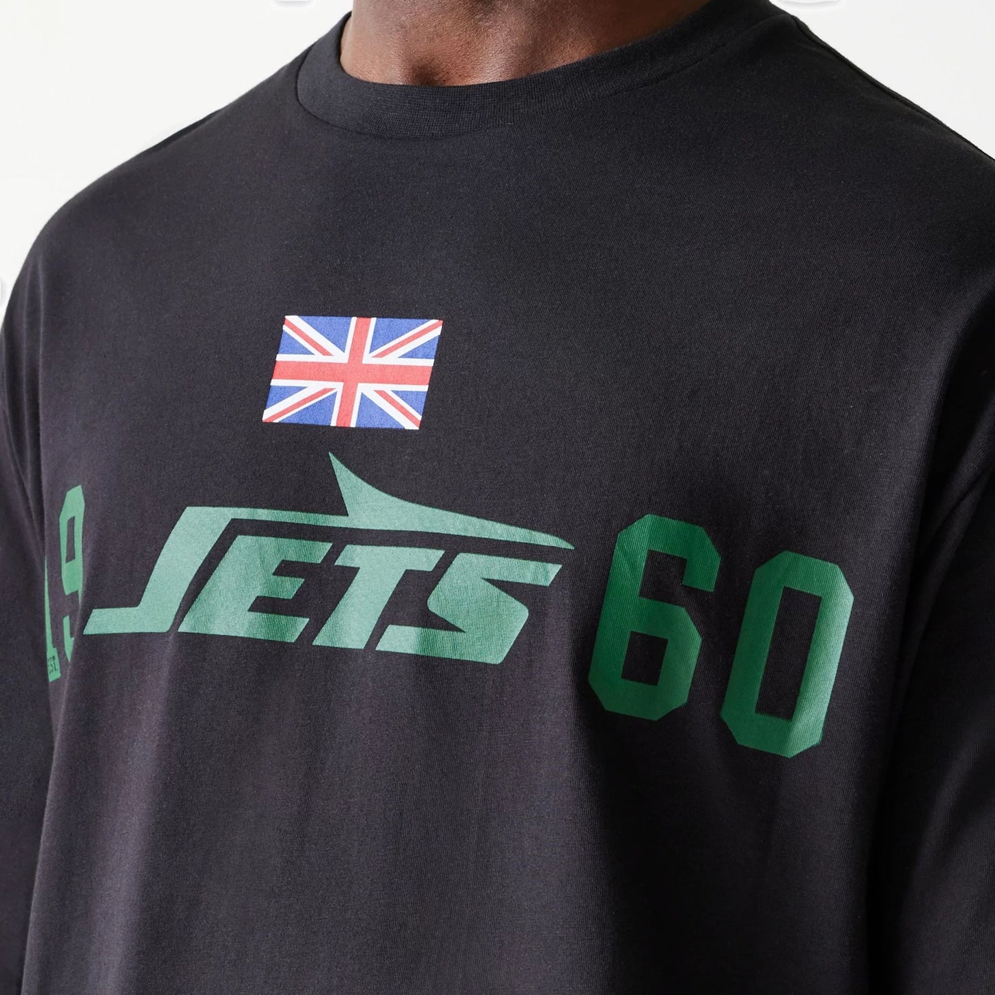 The Male model is wearing New York Jets NFL Games Square Arch Black Oversized T-Shirt 5