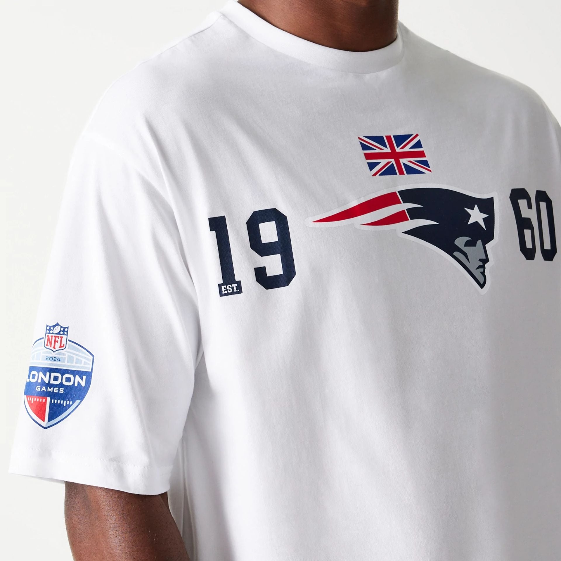 The Male model is wearing New England Patriots NFL Games Square Arch White Oversized T-Shirt 3