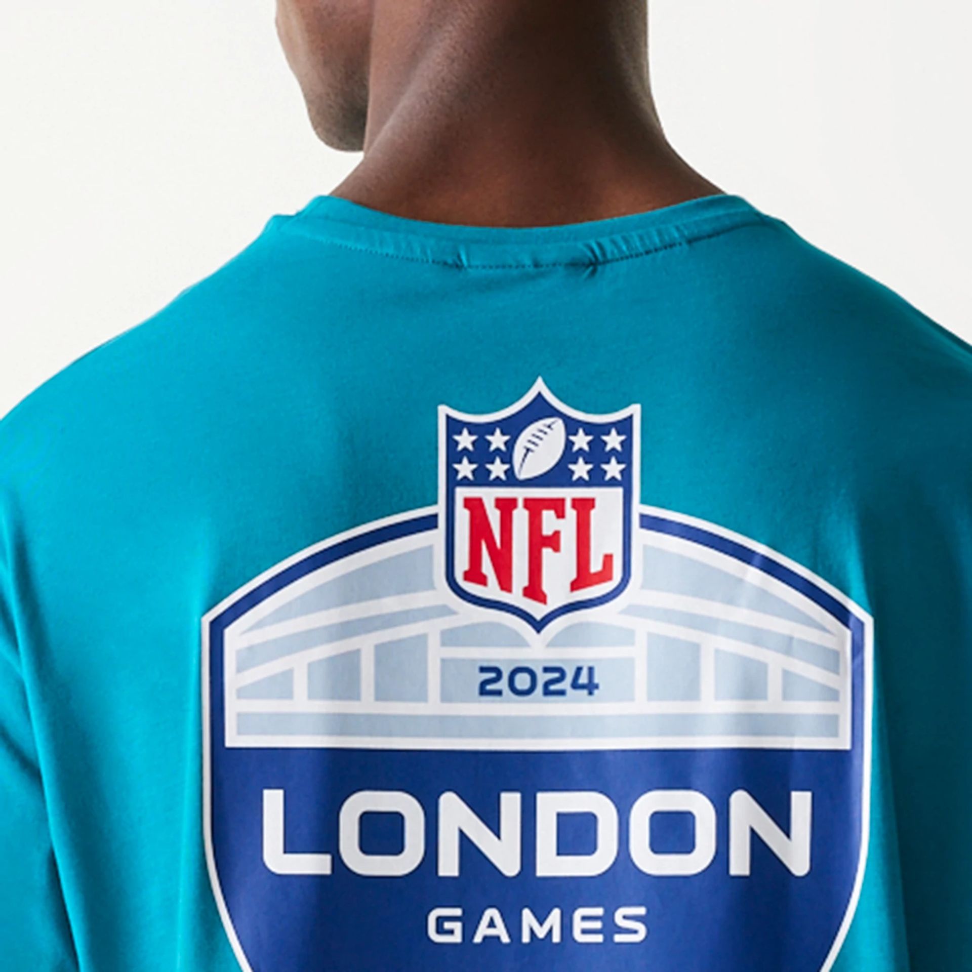 The Male model is wearing Jacksonville Jaguars NFL Games Collegiate Turquoise Oversized T-Shirt 6