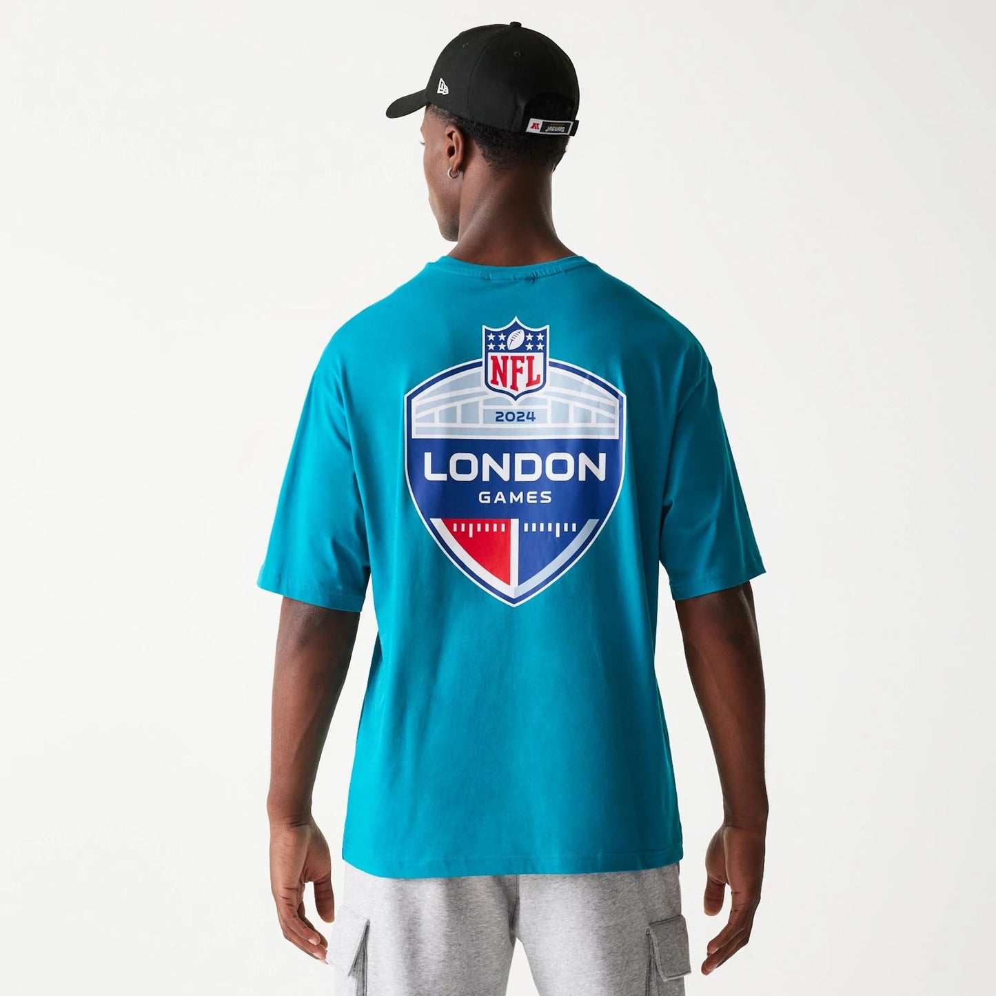 The Male model is wearing Jacksonville Jaguars NFL Games Collegiate Turquoise Oversized T-Shirt 7