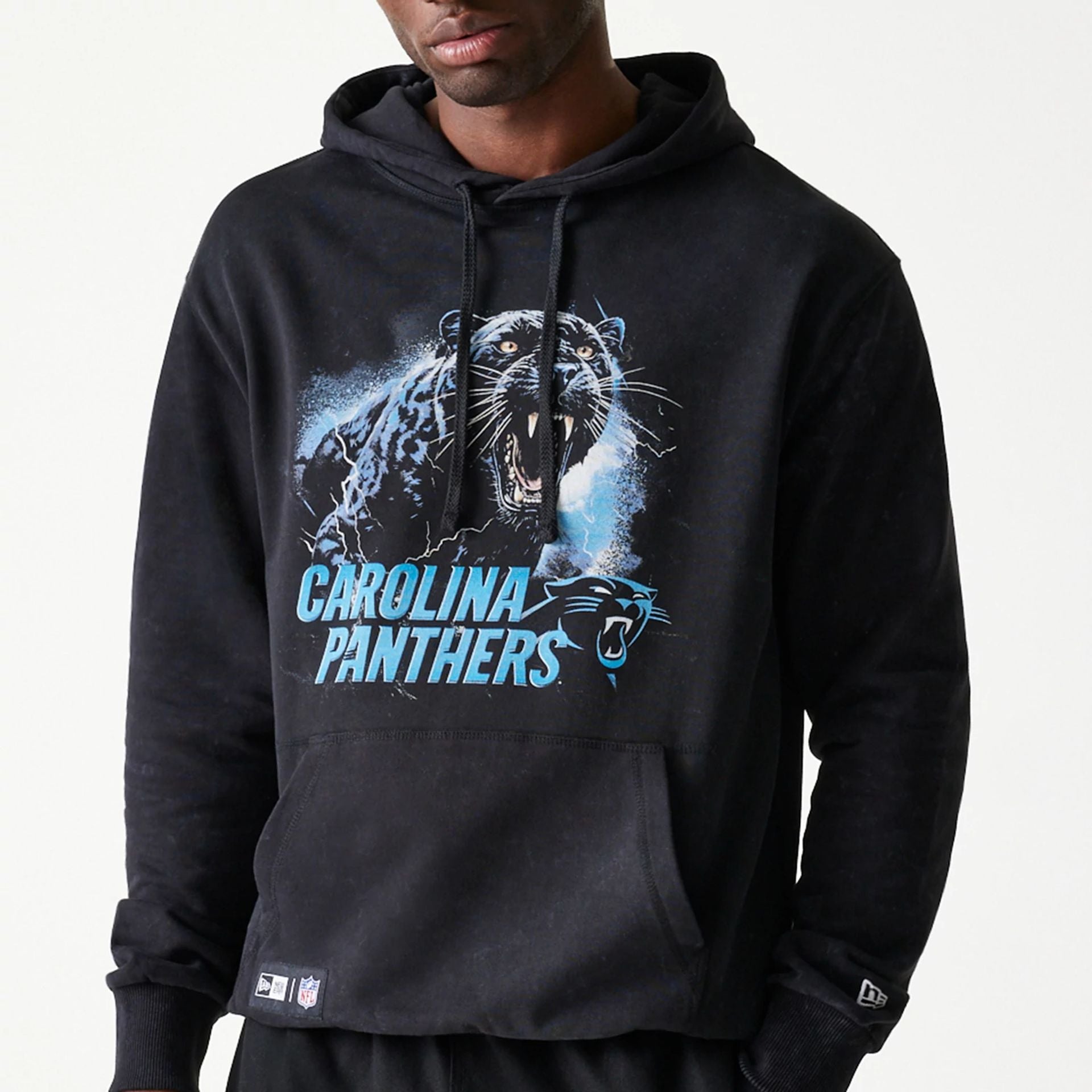 The Male model is wearing Carolina Panthers NFL Games Premium Apparel Black Oversized Pullover Hoodie 2