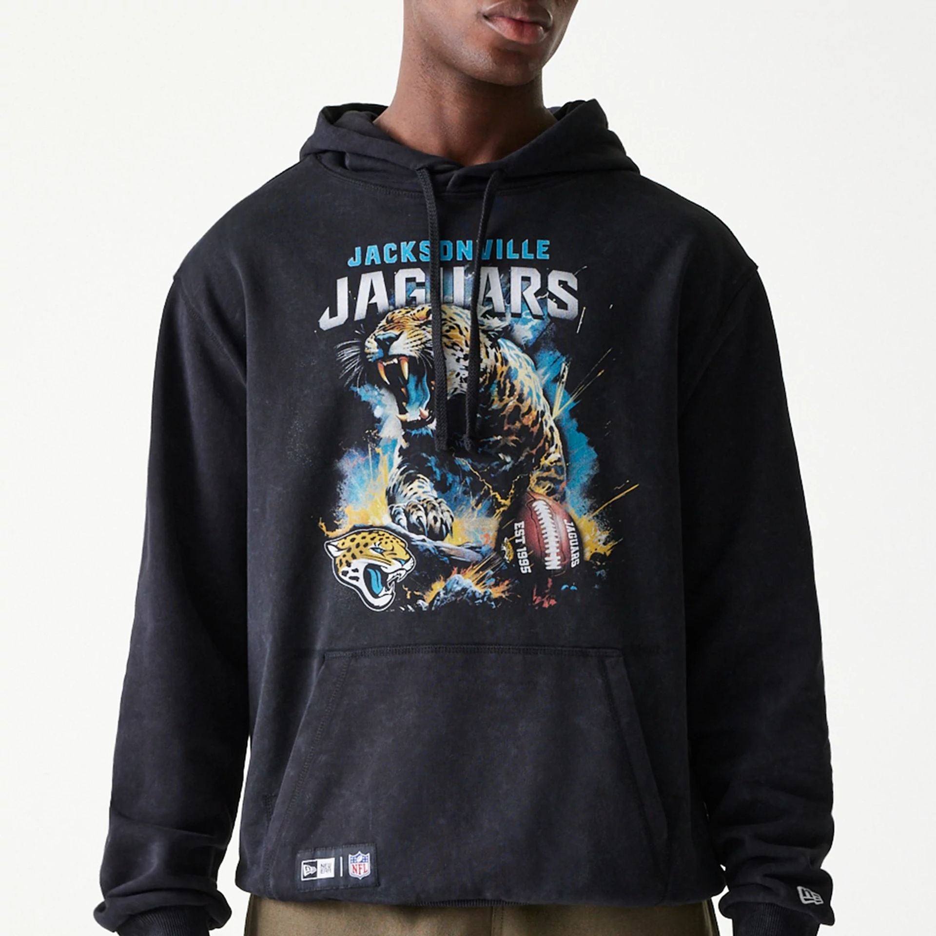 The Male model is wearing Jacksonville Jaguars NFL Games Premium Apparel Black Oversized Pullover Hoodie 2