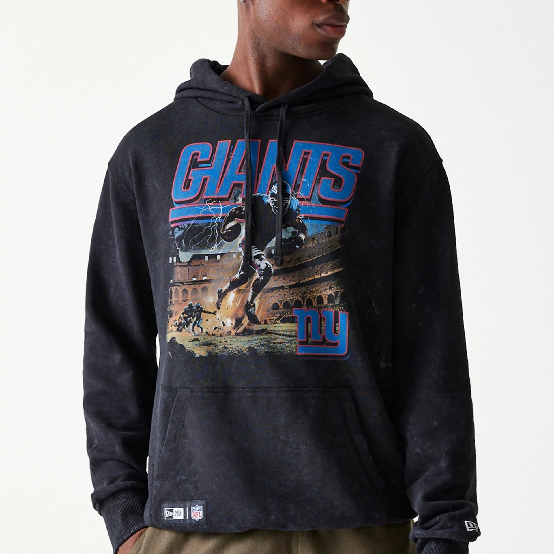 The Male model is wearing New York Giants NFL Games Premium Apparel Black Oversized Pullover Hoodie 2