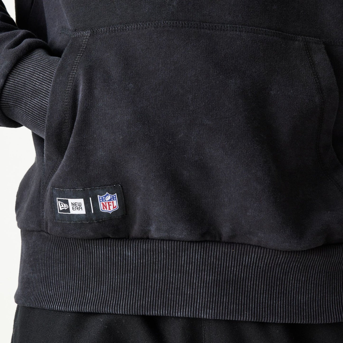 The Male model is wearing New York Giants NFL Games Premium Apparel Black Oversized Pullover Hoodie 8