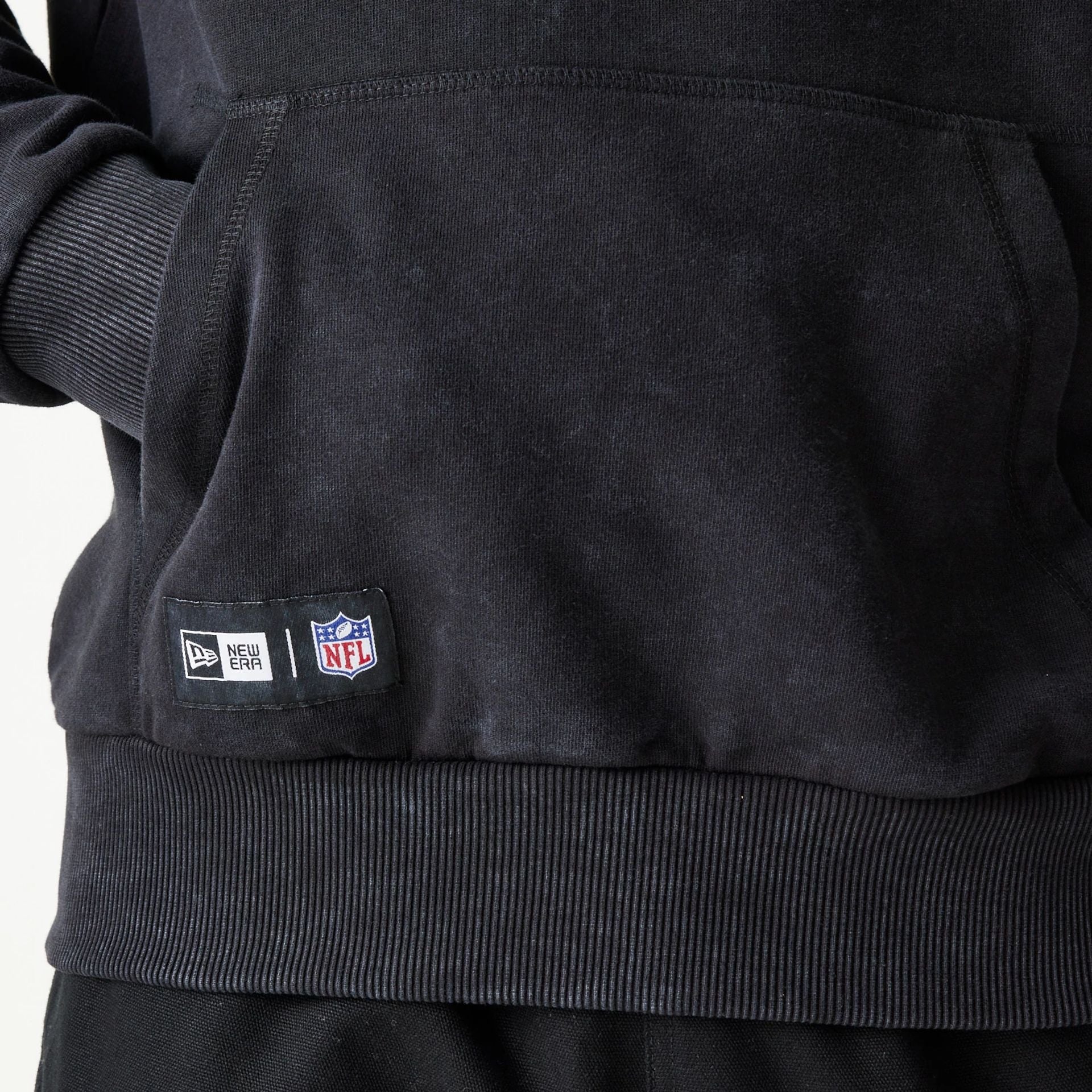 The Male model is wearing New England Patriots NFL Games Premium Apparel Black Oversized Pullover Hoodie 8