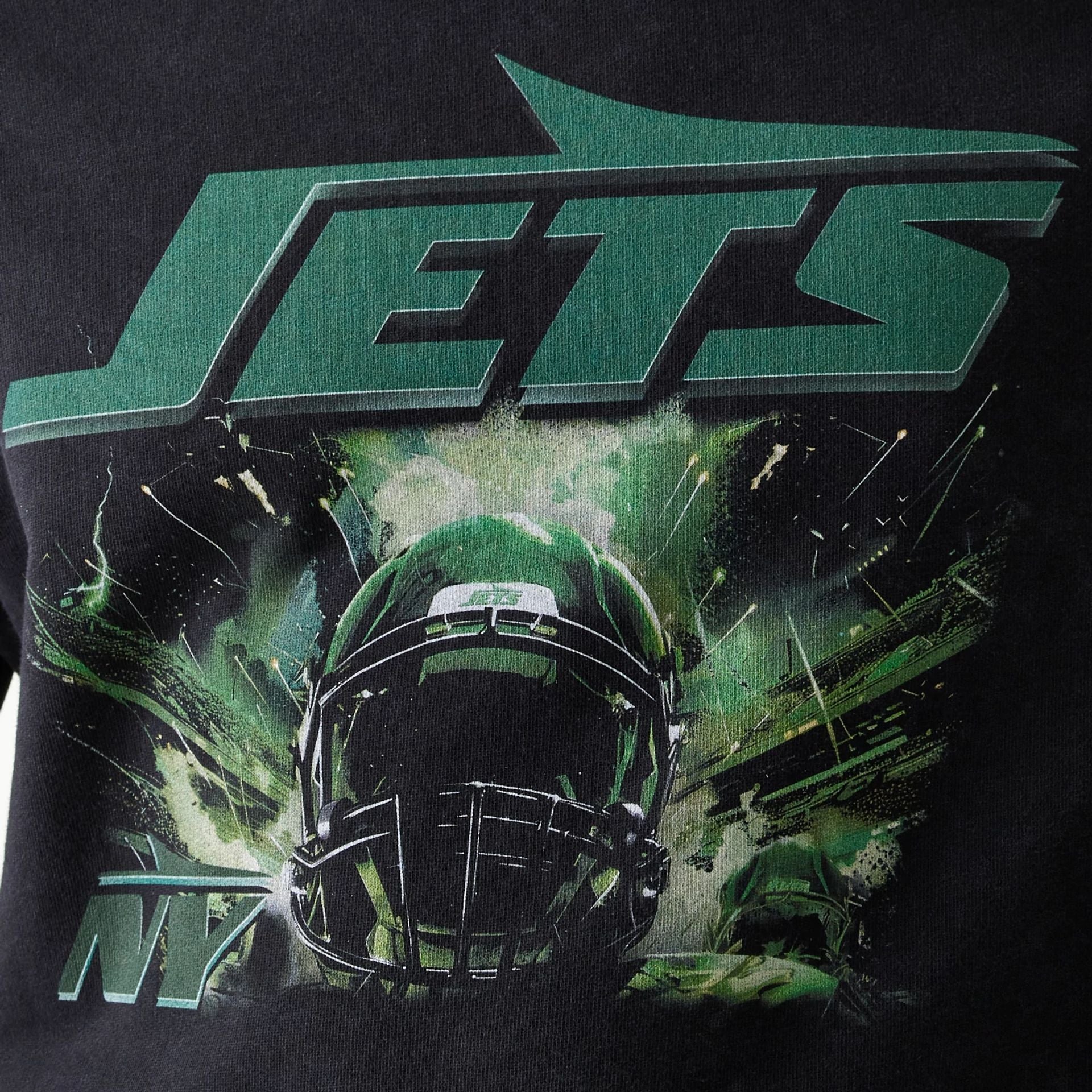 The Male model is wearing New York Jets NFL Games Premium Apparel Black Oversized Pullover Hoodie 5