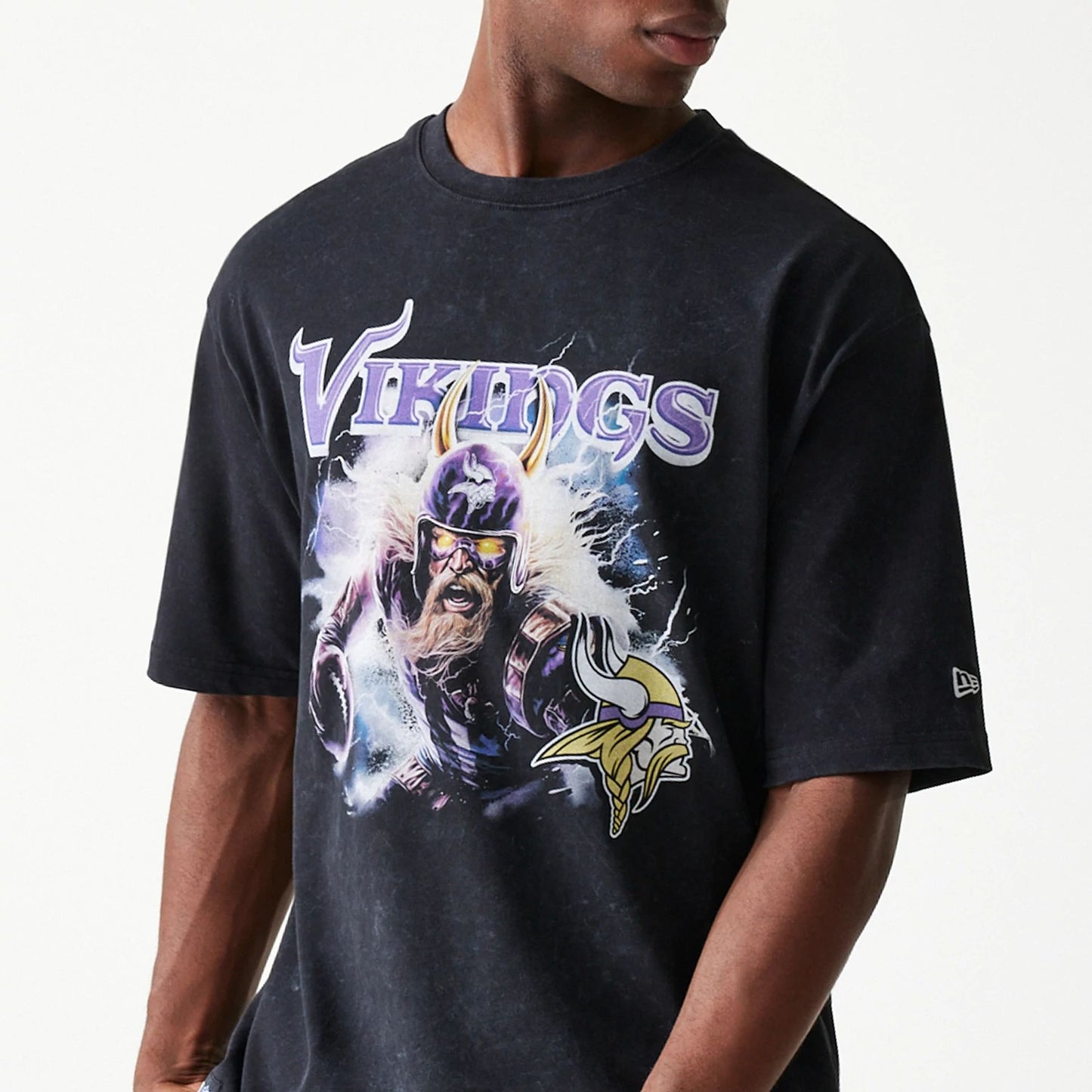 The Male model is wearing Minnesota Vikings NFL Games Premium Apparel Black Oversized T-Shirt 2