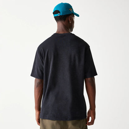 The Male model is wearing Jacksonville Jaguars NFL Games Premium Apparel Black Oversized T-Shirt 7