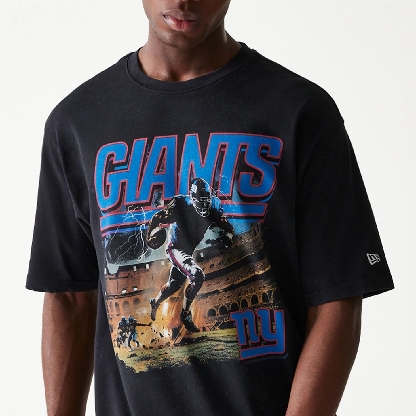 The Male model is wearing New York Giants NFL Games Premium Apparel Black Oversized T-Shirt 2