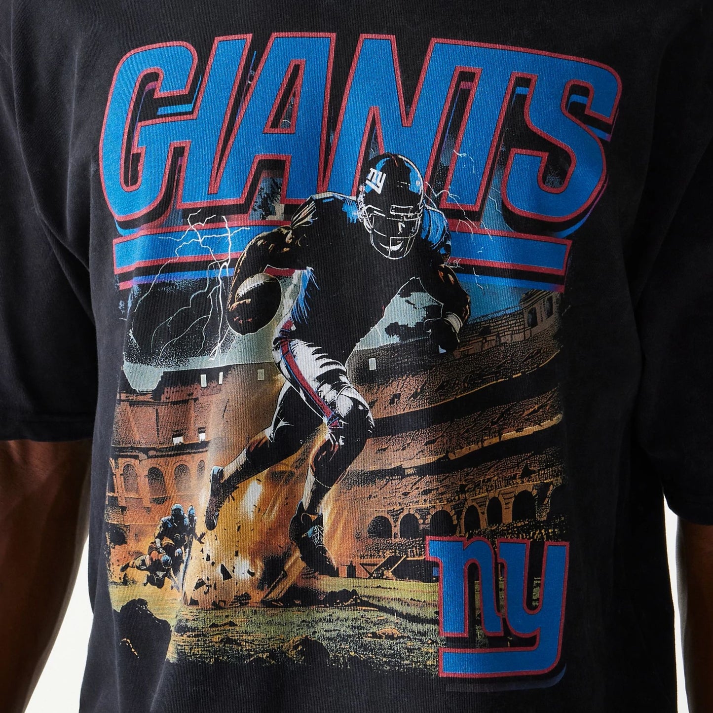 The Male model is wearing New York Giants NFL Games Premium Apparel Black Oversized T-Shirt 5