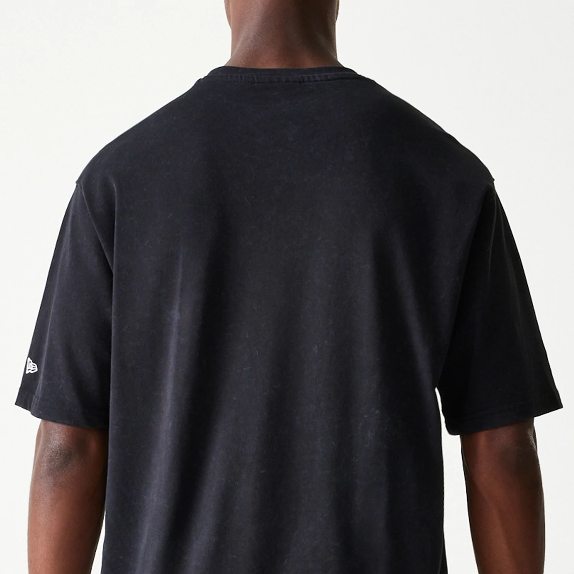 The Male model is wearing New York Giants NFL Games Premium Apparel Black Oversized T-Shirt 6