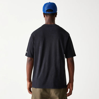 The Male model is wearing New York Giants NFL Games Premium Apparel Black Oversized T-Shirt 7