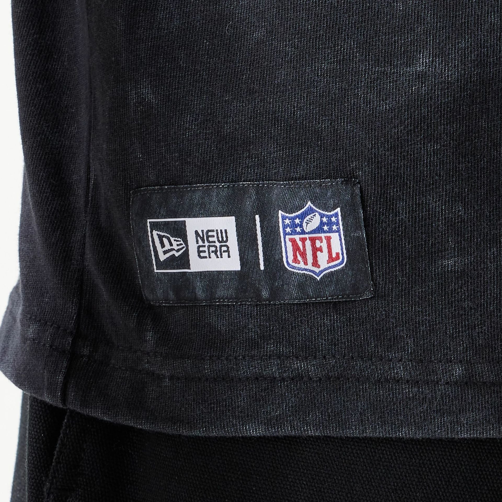 The Male model is wearing New England Patriots NFL Games Premium Apparel Black Oversized T-Shirt 3