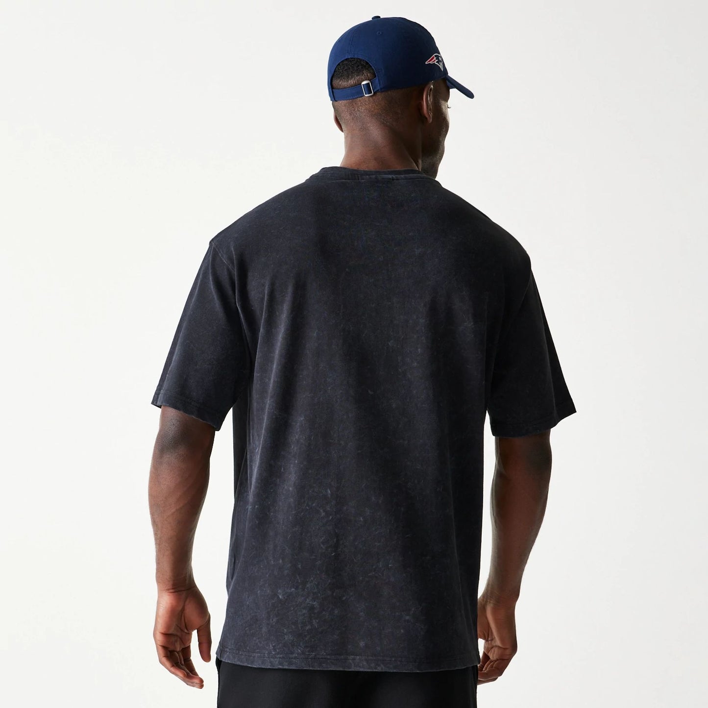 The Male model is wearing New England Patriots NFL Games Premium Apparel Black Oversized T-Shirt 7