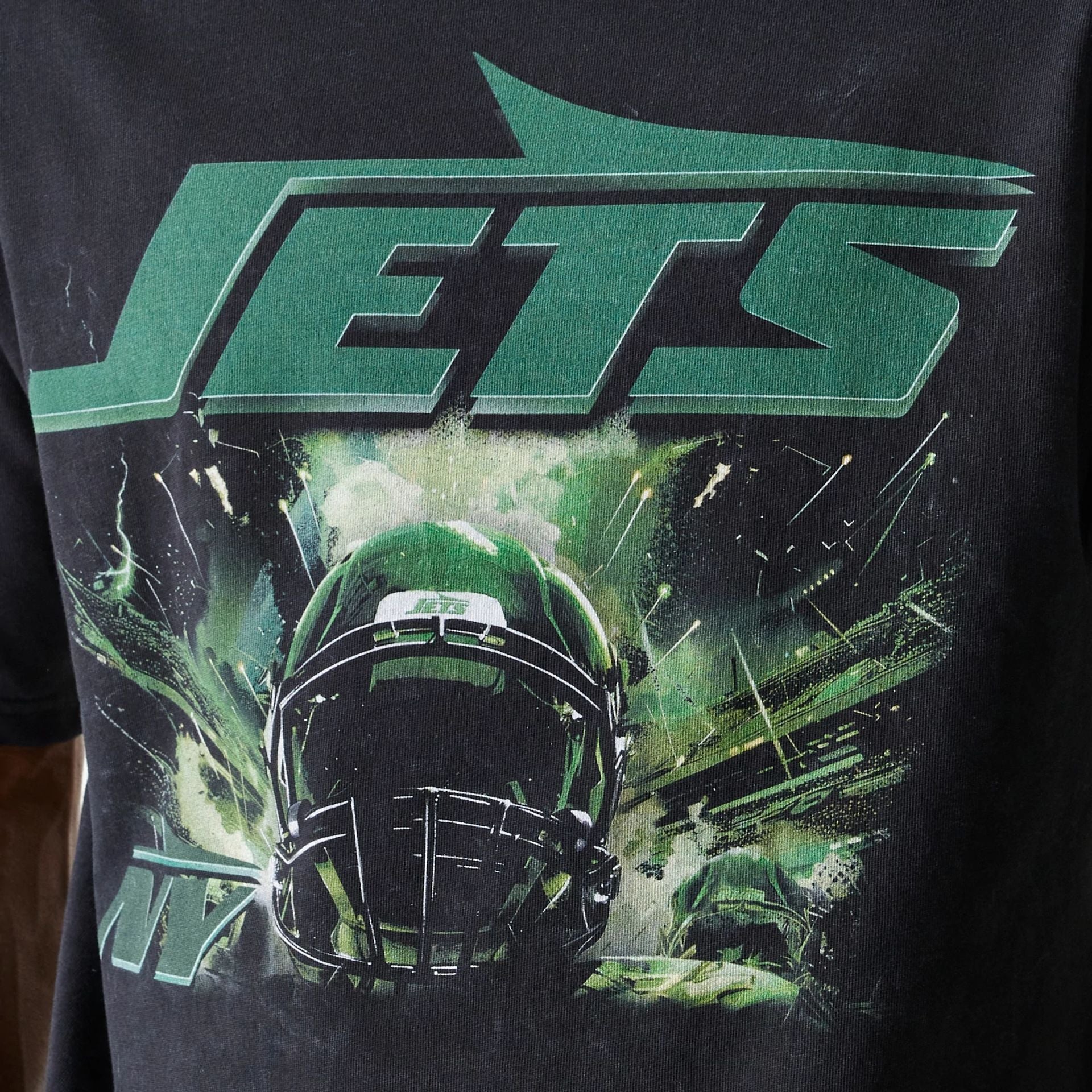 The Male model is wearing New York Jets NFL Games Premium Apparel Black Oversized T-Shirt 5