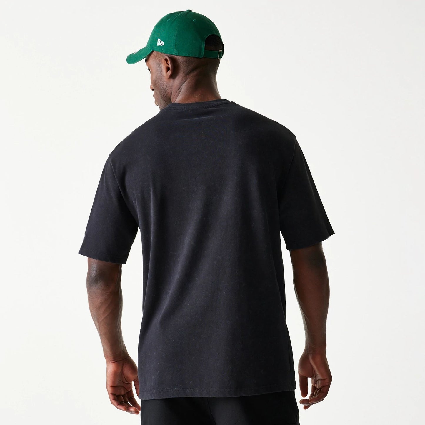 The Male model is wearing New York Jets NFL Games Premium Apparel Black Oversized T-Shirt 7