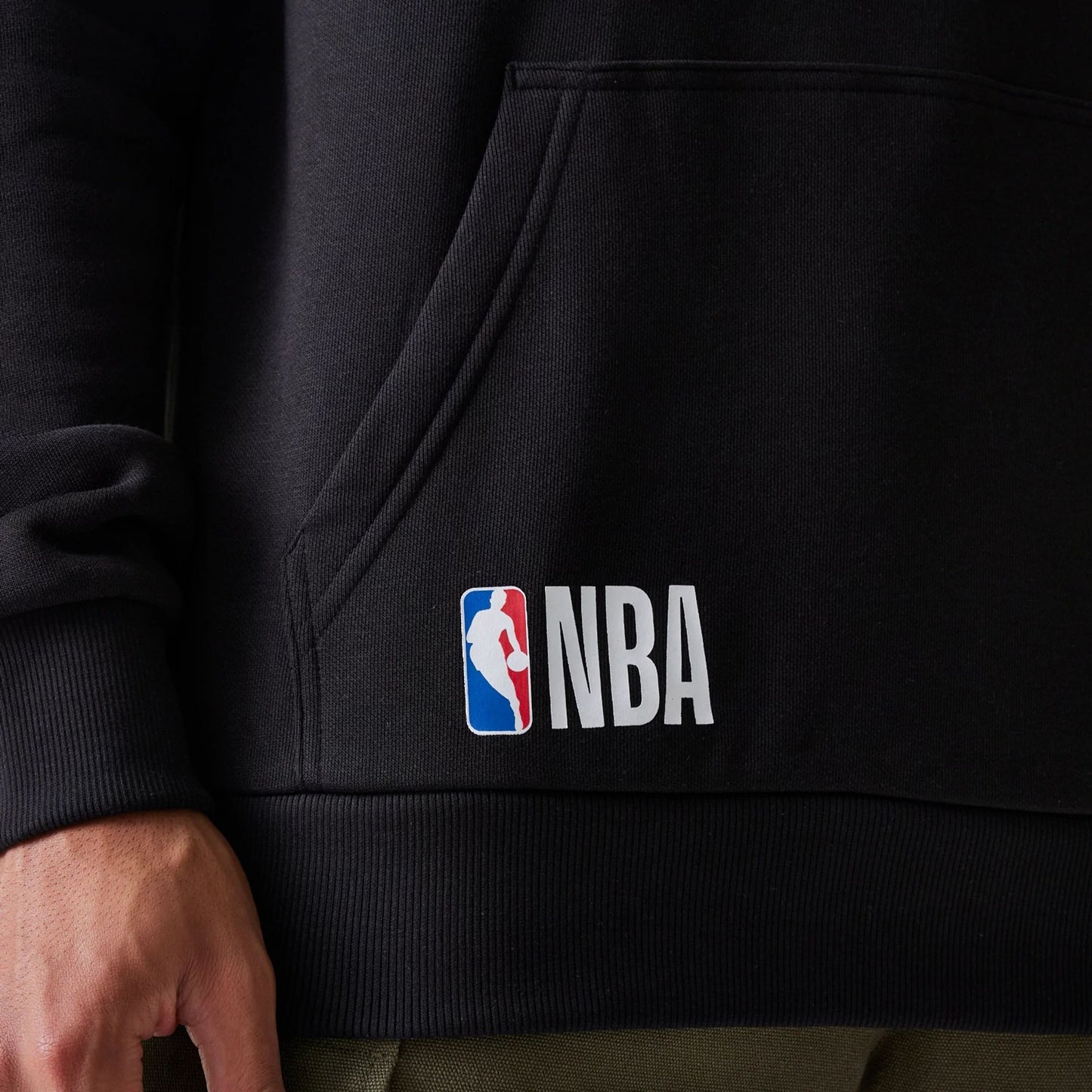 The Male model is wearing San Antonio Spurs NBA Paris Games 2025 Black Pullover Hoodie 3