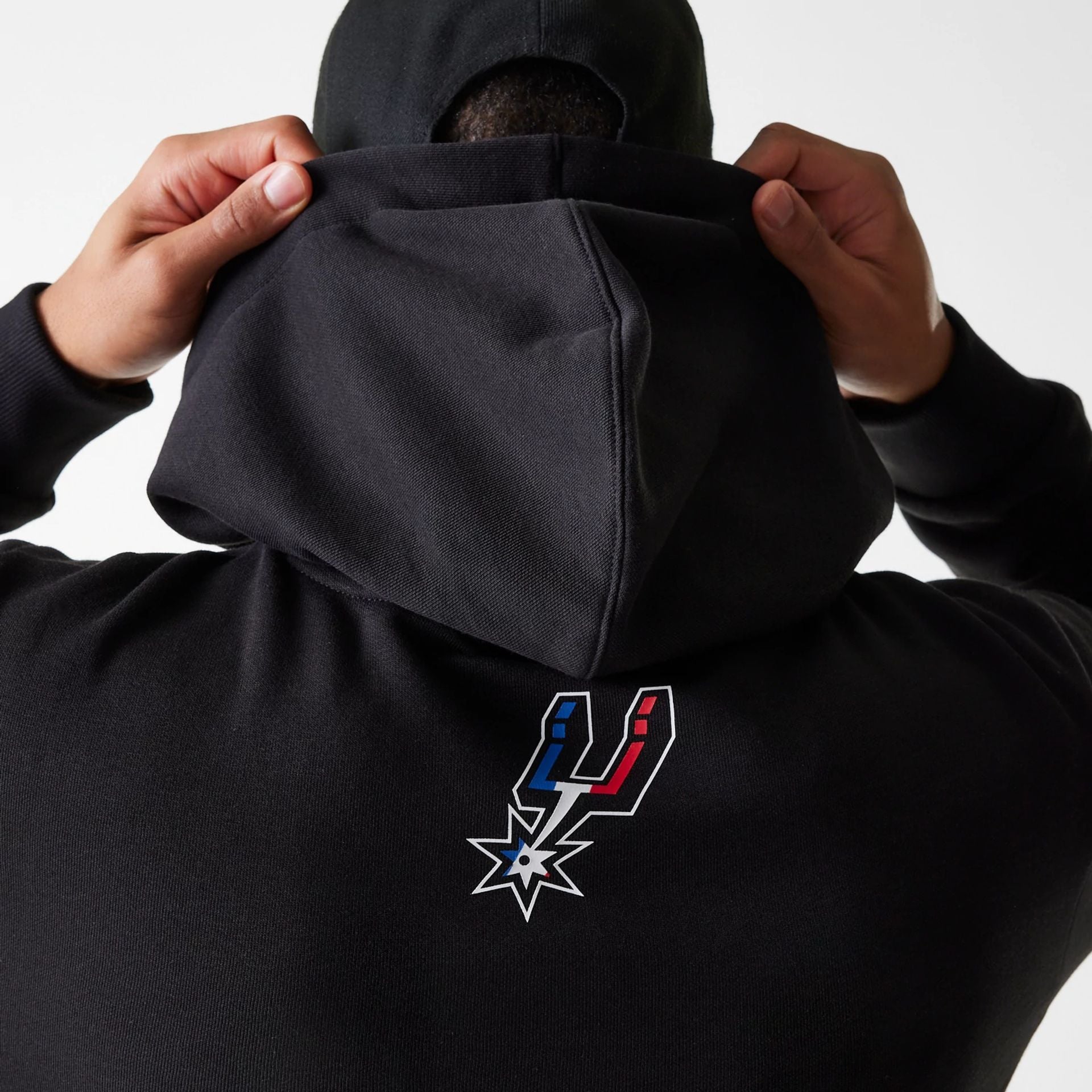 The Male model is wearing San Antonio Spurs NBA Paris Games 2025 Black Pullover Hoodie 6