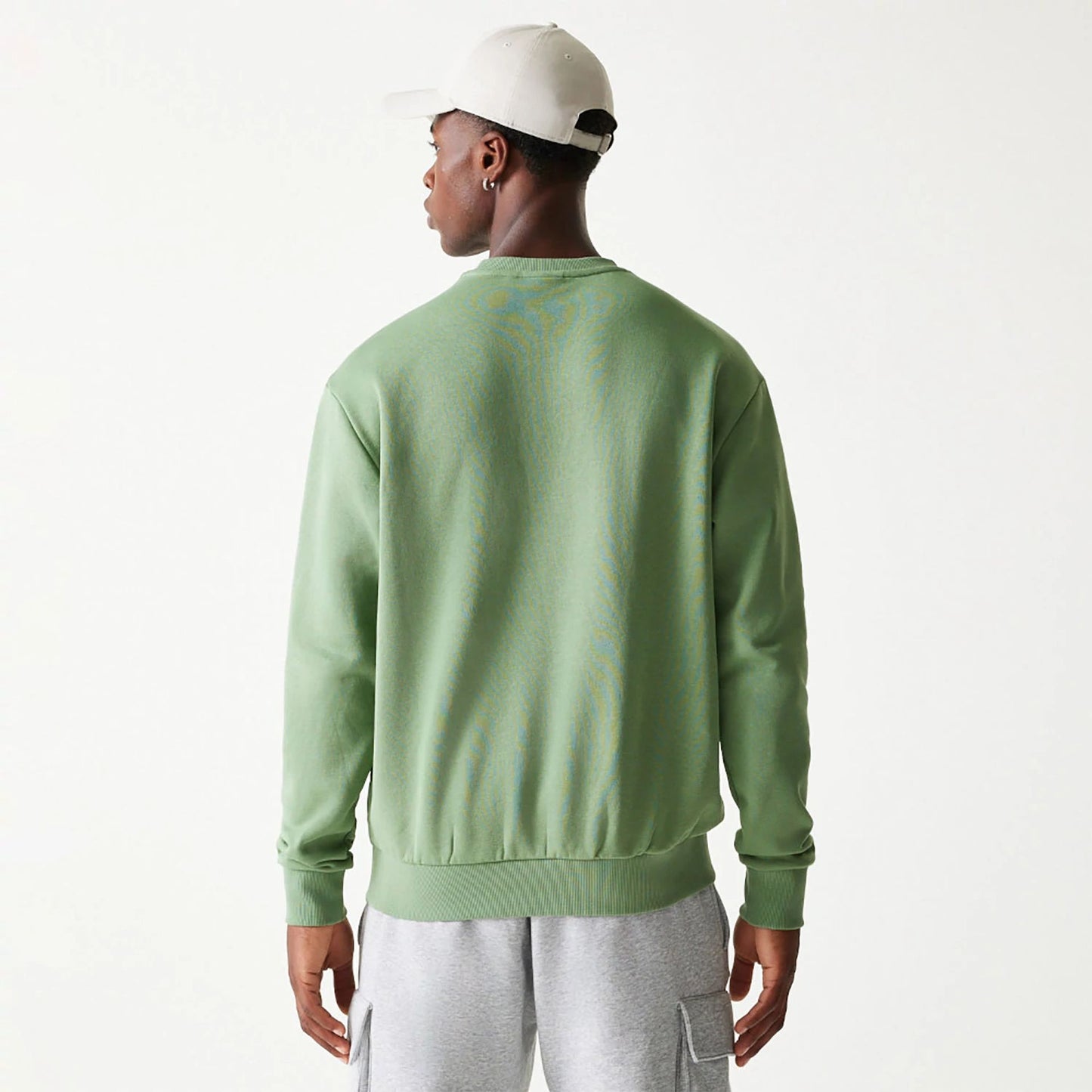 The Male model is wearing New Era Essential Brushed Fleece Green Crewneck Sweater 2