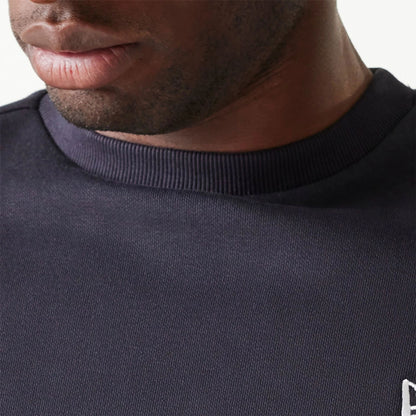 The Male model is wearing New Era Essential Brushed Fleece Navy Crewneck Sweater 7