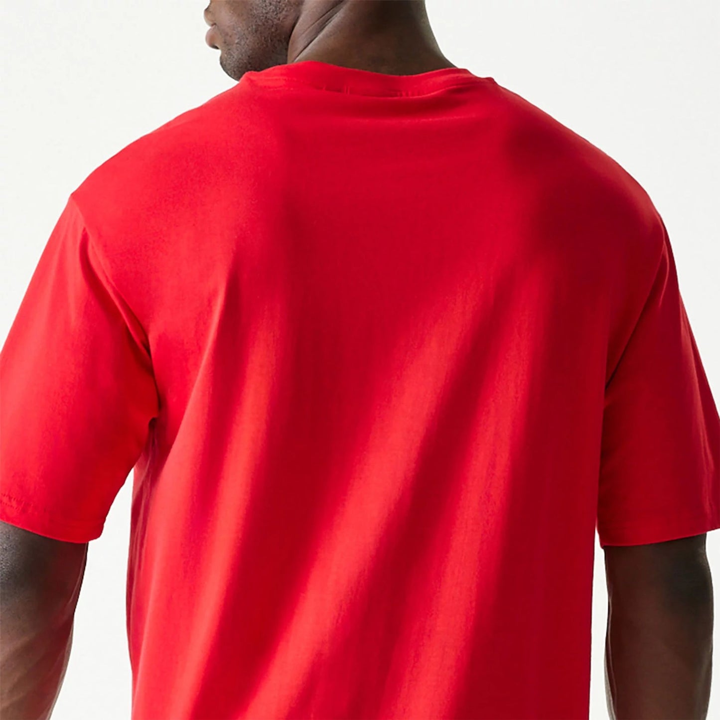 The Male model is wearing New Era Essential Red Oversized T-Shirt 7