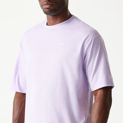 The Male model is wearing New Era Essential Pastel Purple Oversized T-Shirt 6