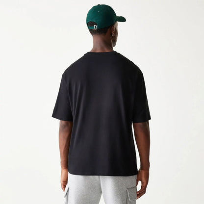 The Male model is wearing New Era Essential Black Oversized T-Shirt 2