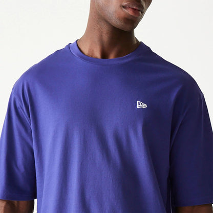 The Male model is wearing New Era Essential Dark Purple Oversized T-Shirt 3