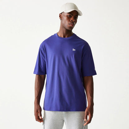 The Male model is wearing New Era Essential Dark Purple Oversized T-Shirt 1