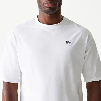 The Male model is wearing New Era Essential White Oversized T-Shirt 3