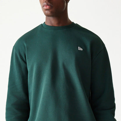 The Male model is wearing New Era Essential Brushed Fleece Dark Green Crewneck Sweater 3