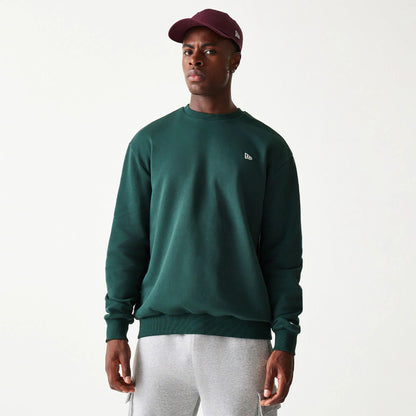 The Male model is wearing New Era Essential Brushed Fleece Dark Green Crewneck Sweater 1