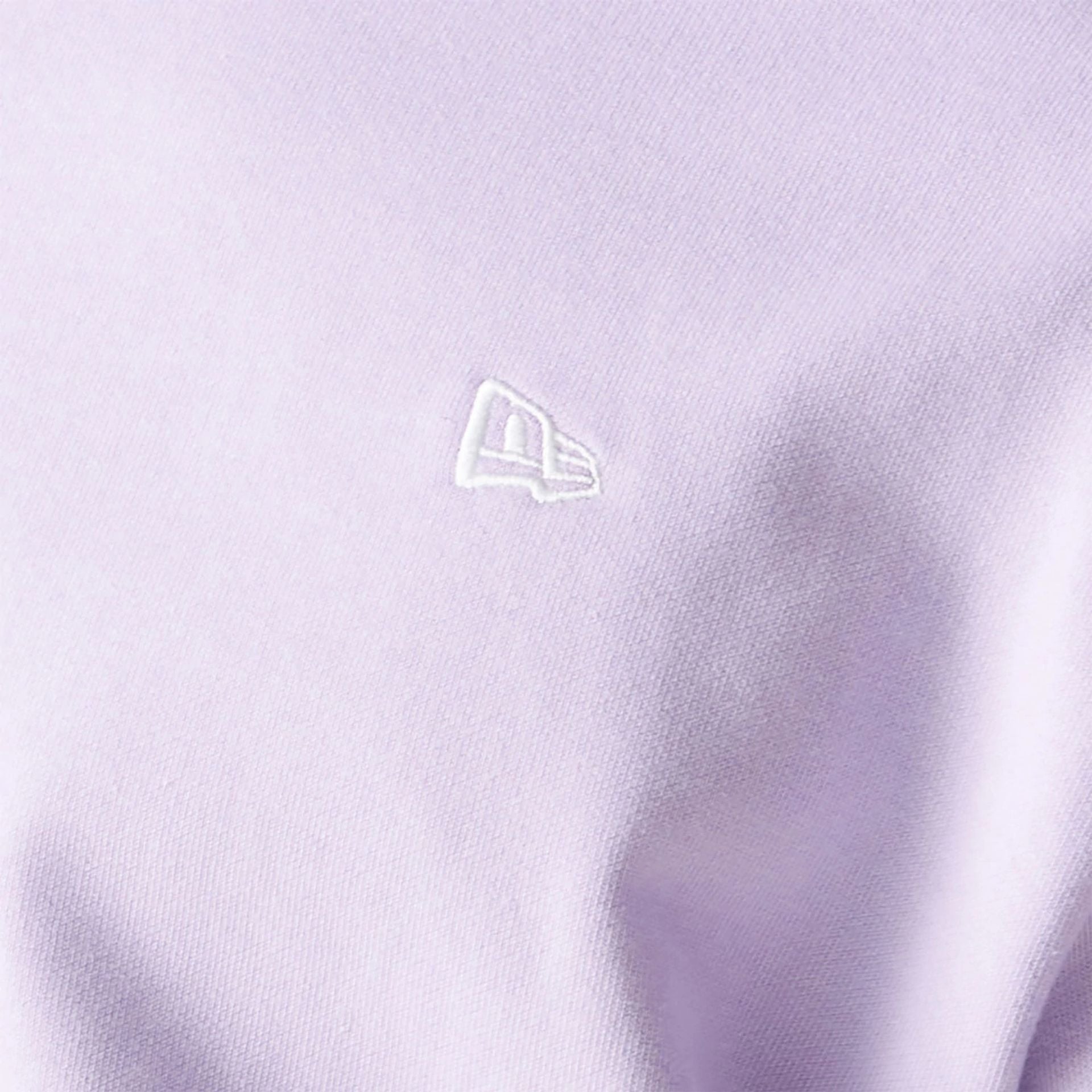 The Male model is wearing New Era Essential Pastel Purple Crewneck Sweater 4