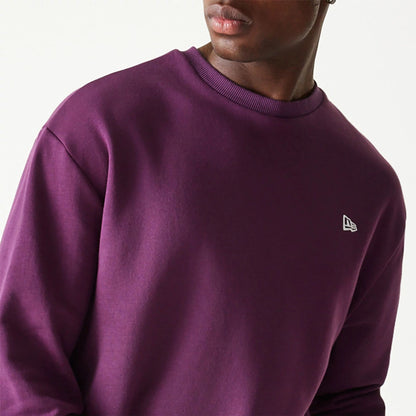 The Male model is wearing New Era Essential Brushed Fleece Dark Purple Crewneck Sweater 3