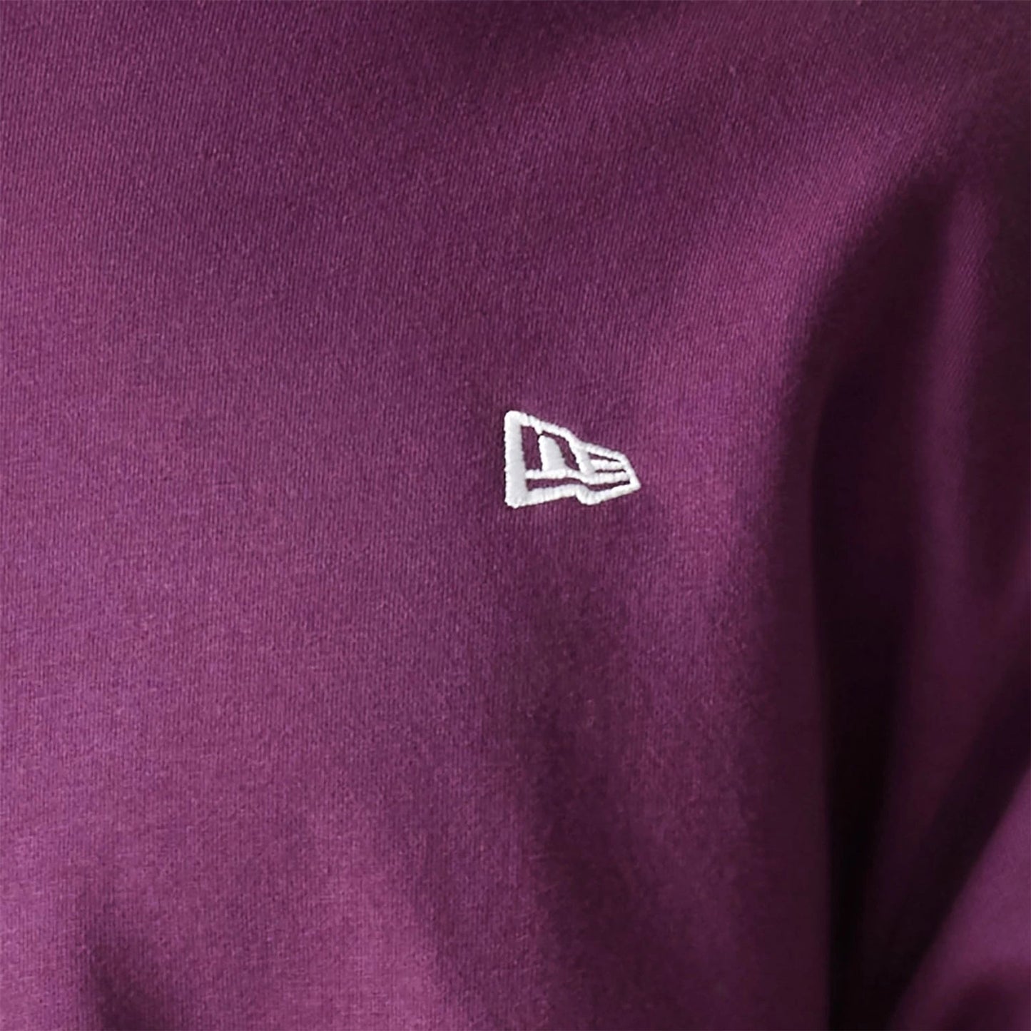 The Male model is wearing New Era Essential Brushed Fleece Dark Purple Crewneck Sweater 5