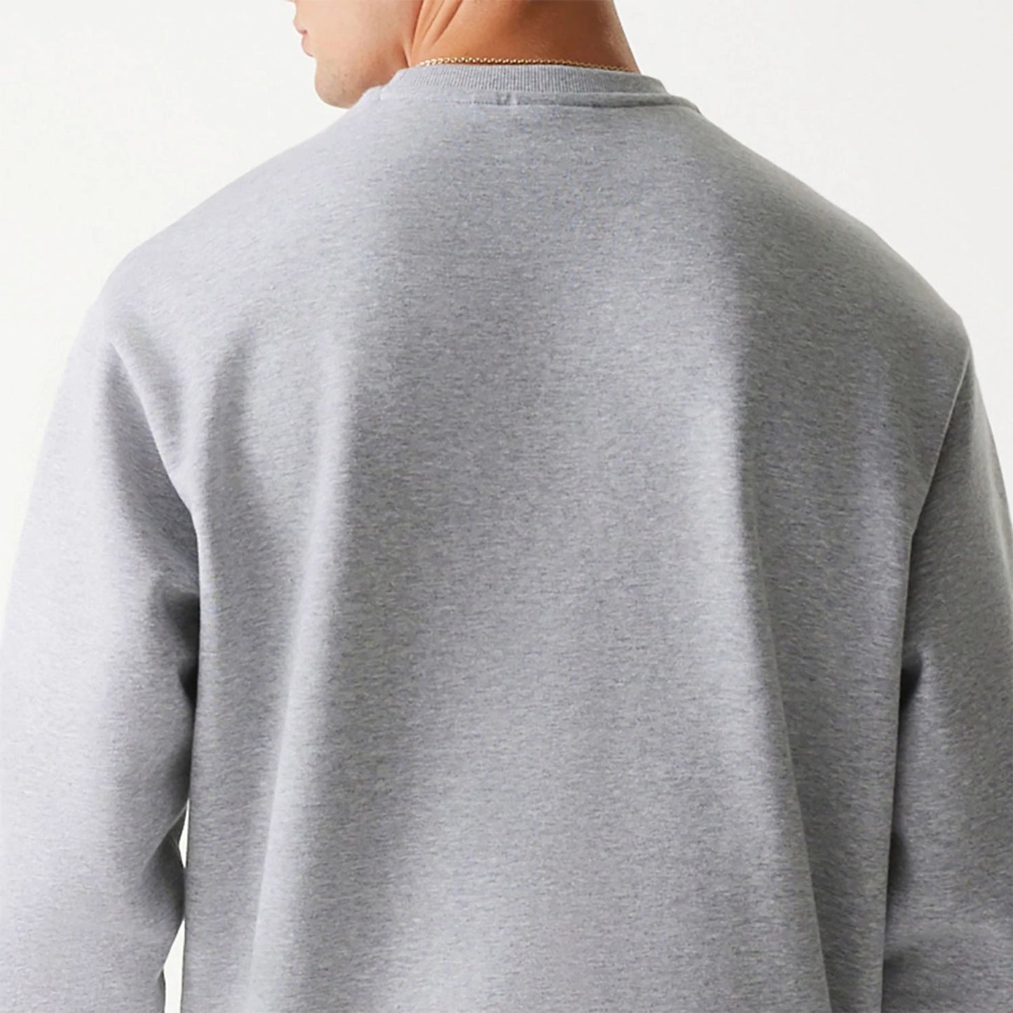 The Male model is wearing New Era Essential Brushed Fleece Grey Crewneck Sweater 7