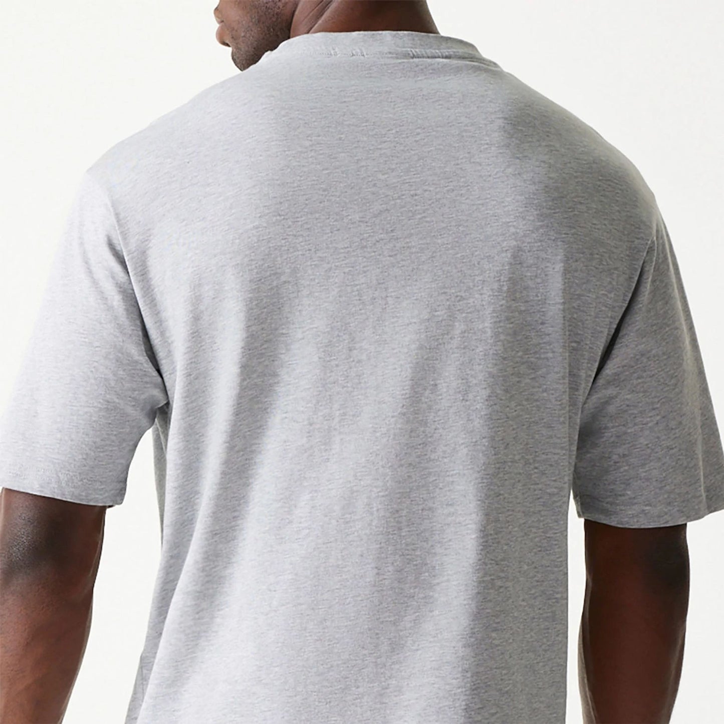 The Male model is wearing New Era Essential Grey Oversized T-Shirt 7