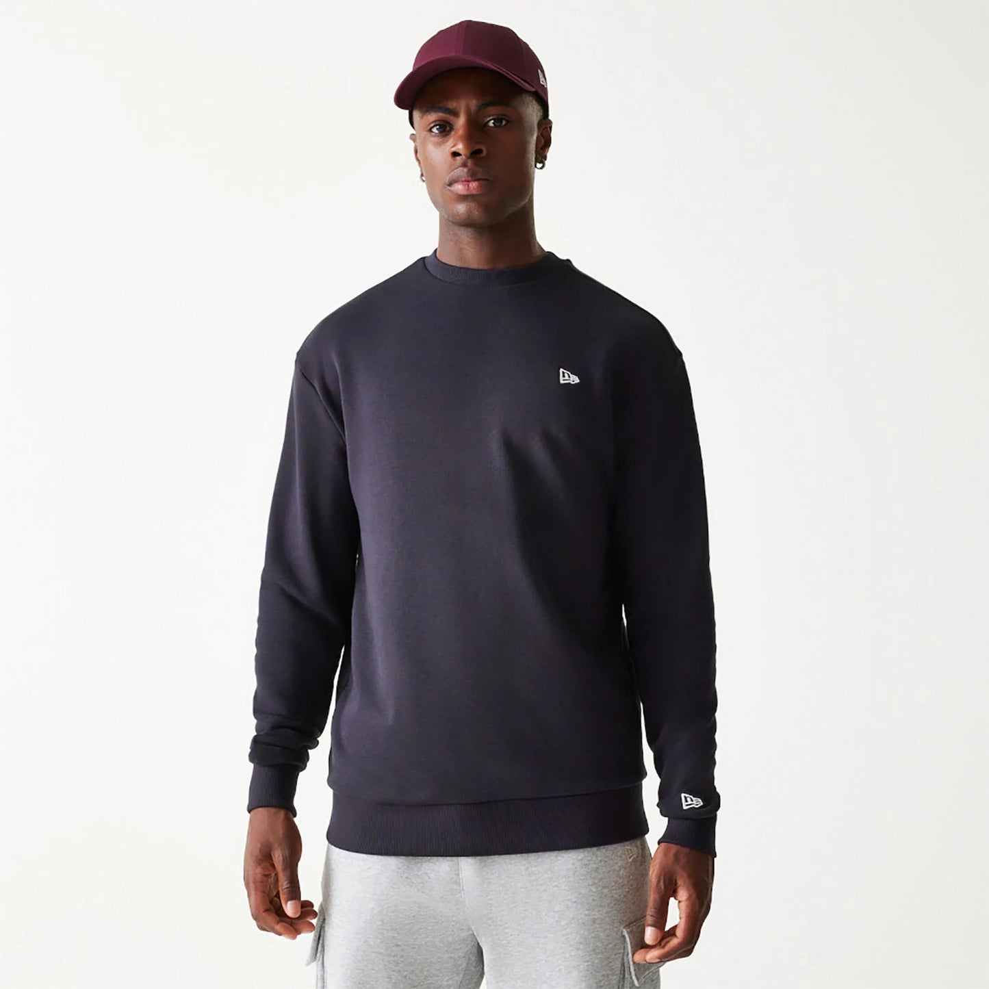 The Male model is wearing New Era Essential Navy Crewneck Sweater 1