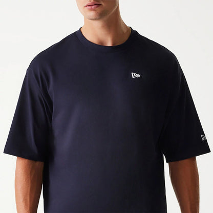 The Male model is wearing New Era Essential Navy Oversized T-Shirt 3