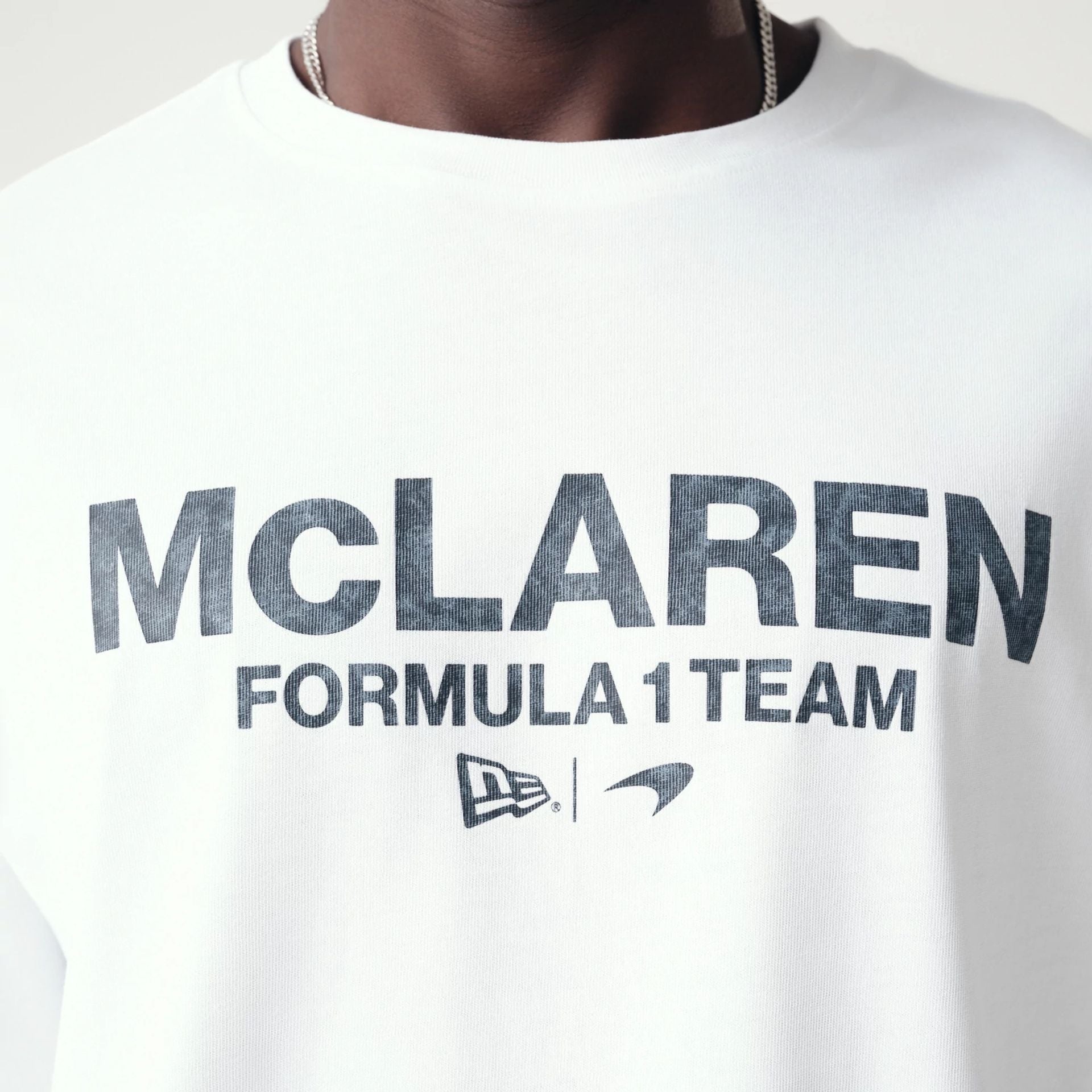 The Male model is wearing McLaren Racing Washed Pack White Oversized T-Shirt 4