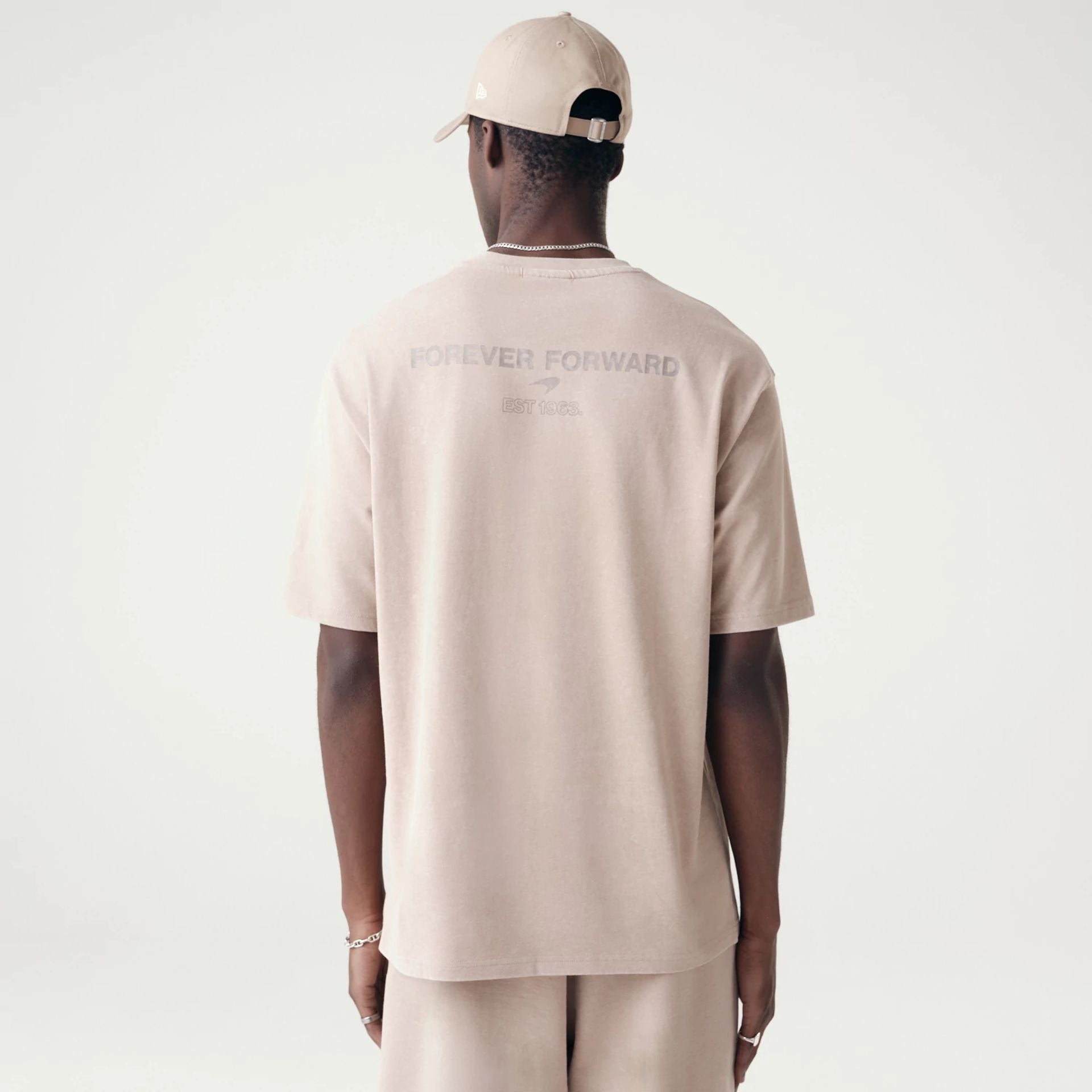 The Male model is wearing McLaren Racing Washed Pack Beige Oversized T-Shirt 2