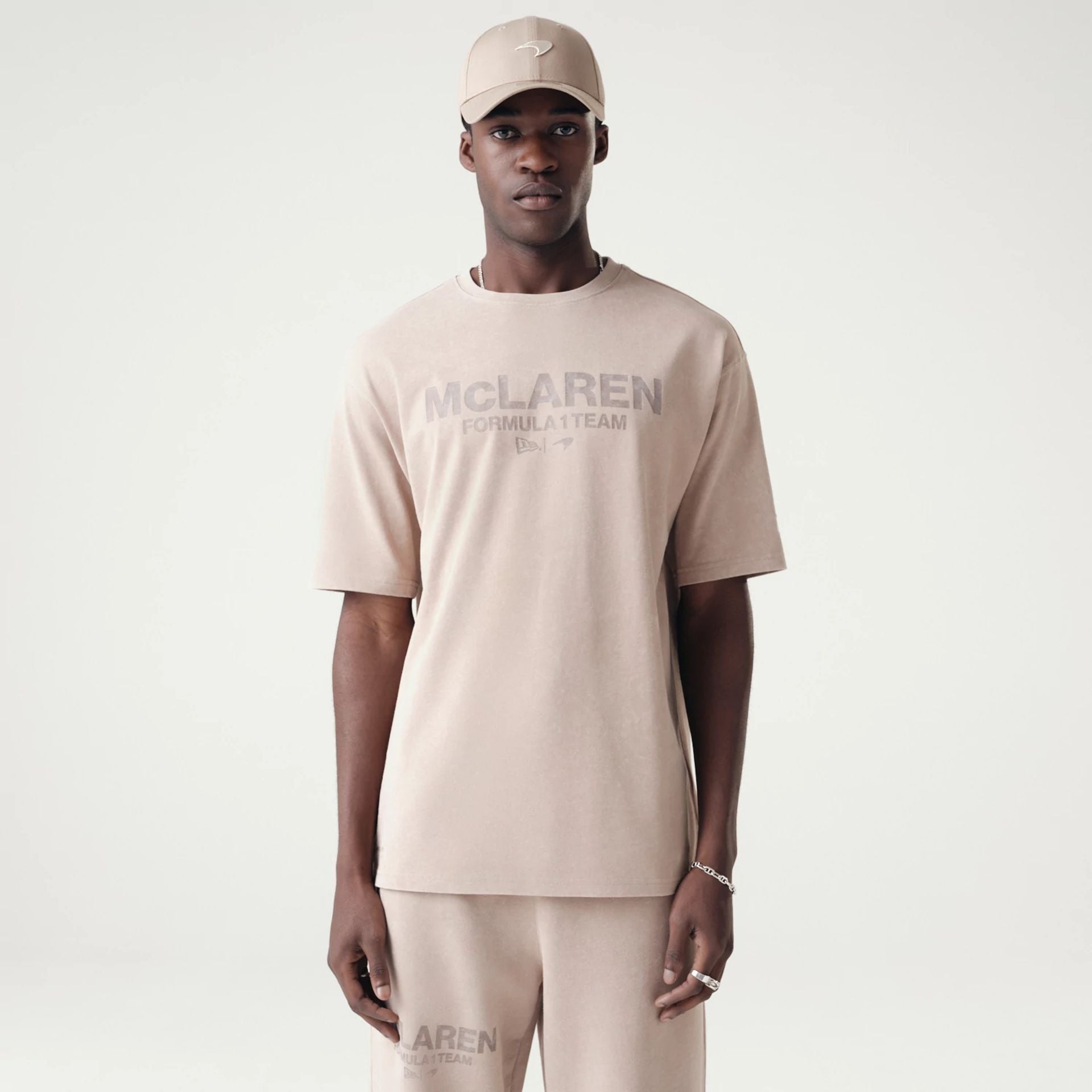 The Male model is wearing McLaren Racing Washed Pack Beige Oversized T-Shirt 1