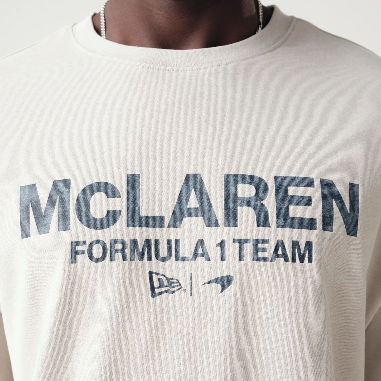 The Male model is wearing McLaren Racing Washed Pack Cream Oversized T-Shirt 4