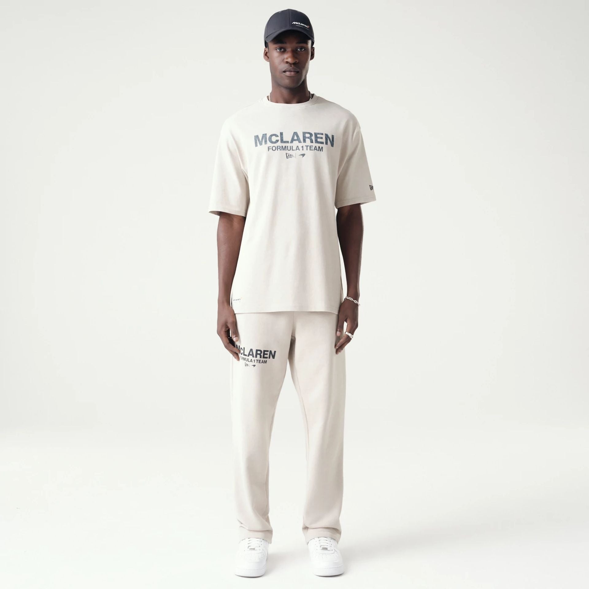 The Male model is wearing McLaren Racing Washed Pack Cream Oversized T-Shirt 8