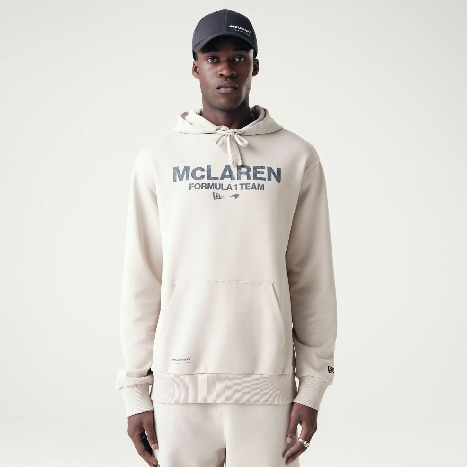 The Male model is wearing McLaren Racing Washed Pack Cream Oversized Hoodie 1